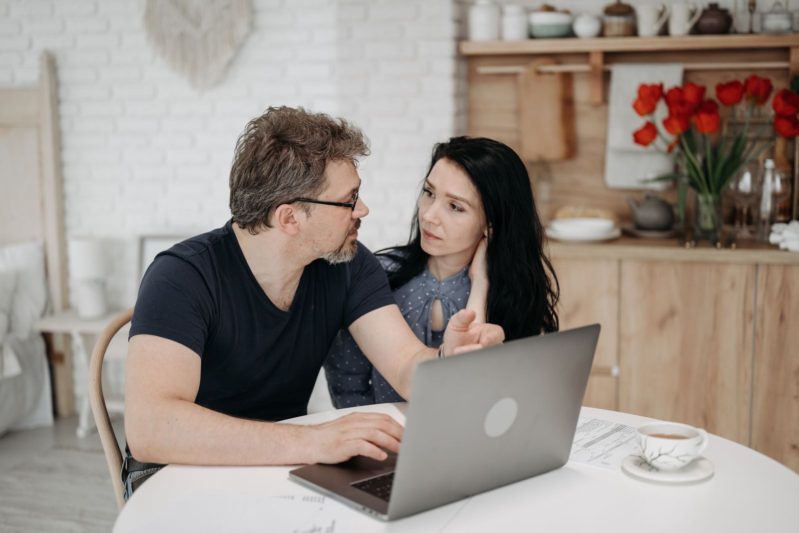 Couple planning travel on a laptop
